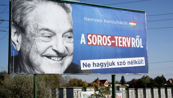 A billboard with a poster of Hungarian-American billionaire and philanthropist George Soros with the lettering National consultation about the Soros' plan - Don't let it pass without any words is seen in the 22nd district of Budapest on October 16, 2017 - Sputnik International
