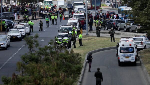 Police and security personnel work at the scene where a car bomb exploded, according to authorities, in Bogota, Colombia January 17, 2019 - Sputnik International