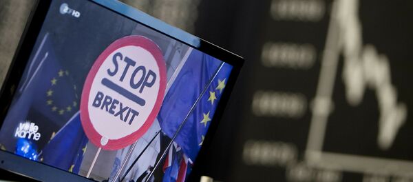 A computer screen shows news about the Brexit as the curve of the German stock index DAX is seen at the stock market in Frankfurt, Germany, Wednesday, Jan. 16, 2019 - Sputnik International