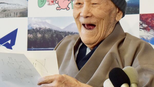 Masazo Nonaka of Japan, aged 112, smiles after being awarded the Guinness World Records' oldest male person living title in Ashoro, Hokkaido prefecture on April 10, 2018. Nonaka was born on July 25, 1905. - Sputnik International