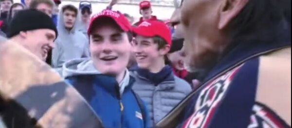 MAGA-wearing US high-school students in Washington DC surround and mock Native American Vietnam veteran chanting to honor war dead, Friday, January 18, 2019. MAGA-wearing US high-school students in Washington DC surround and mock Native American Vietnam veteran chanting to honor war dead, Friday, January 18, 2019. - Sputnik International
