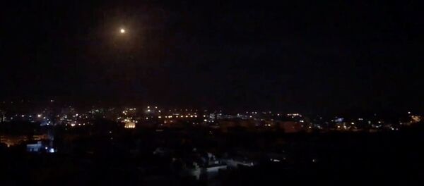 What is believed to be guided missiles are seen in the sky during what is reported to be an attack in Damascus, Syria, January 21, 2019, in this still image taken from a video obtained from social media - Sputnik International