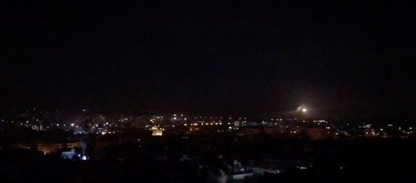 What is believed to be guided missiles are seen in the sky during what is reported to be an attack in Damascus, Syria, January 21, 2019, in this still image taken from a video obtained from social media - Sputnik International