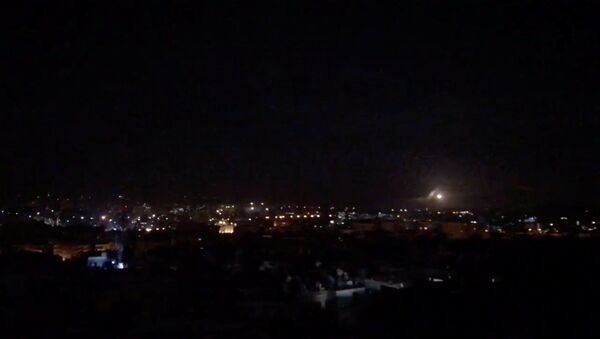 What is believed to be guided missiles are seen in the sky during what is reported to be an attack in Damascus, Syria, January 21, 2019, in this still image taken from a video obtained from social media - Sputnik International