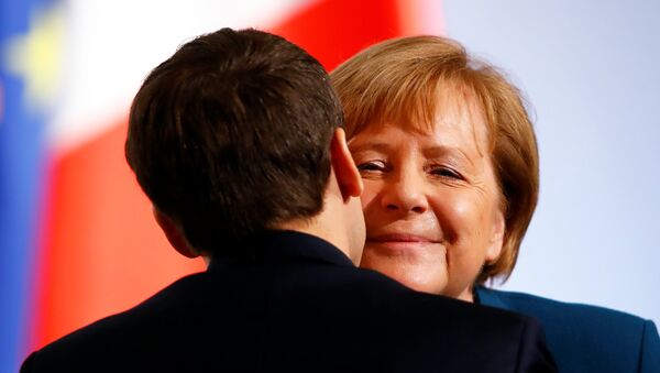 German Chancellor Angela Merkel and French President Emmanuel Macron attend a signing of a new agreement on bilateral cooperation and integration, known as Treaty of Aachen, in Aachen, Germany, January 22, 2019 - Sputnik International