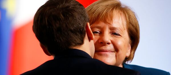 German Chancellor Angela Merkel and French President Emmanuel Macron attend a signing of a new agreement on bilateral cooperation and integration, known as Treaty of Aachen, in Aachen, Germany, January 22, 2019 - Sputnik International