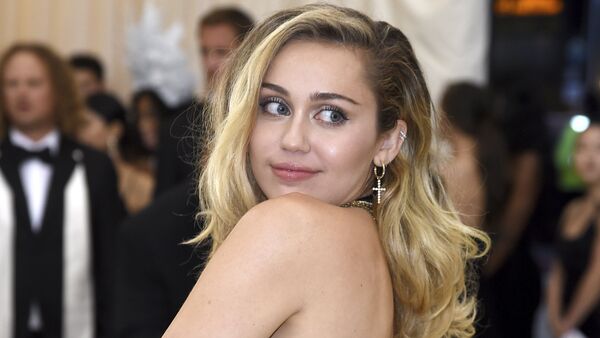 Miley Cyrus attends The Metropolitan Museum of Art's Costume Institute benefit gala celebrating the opening of the Heavenly Bodies: Fashion and the Catholic Imagination exhibition on Monday, May 7, 2018, in New York - Sputnik International