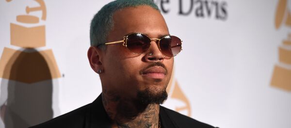In this file photo taken on February 7, 2015 US rapper Chris Brown attends the Pre-GRAMMY Gala at The Beverly Hilton Hotel in Beverly Hills, California. In this file photo taken on February 7, 2015 US rapper Chris Brown attends the Pre-GRAMMY Gala at The Beverly Hilton Hotel in Beverly Hills, California. - Sputnik International