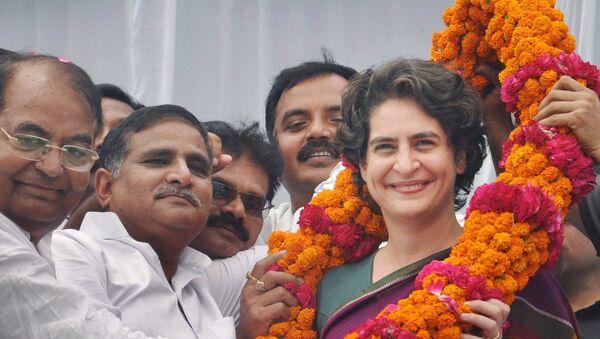 Priyanka Vadra, daughter of Congress party president Sonia Gandhi, receives a floral garland from supporters during an election campaign in her mother’s constituency of Rae Bareli, India, Wednesday, April 23, 2014. - Sputnik International