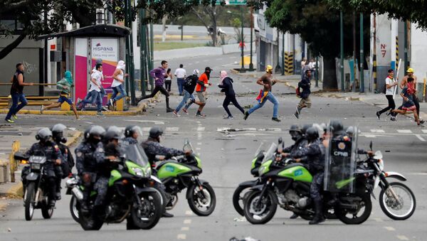 Police secure the area during a protest against Venezuelan President Nicolas Maduro's government in Caracas, Venezuela January 23, 2019. - Sputnik International