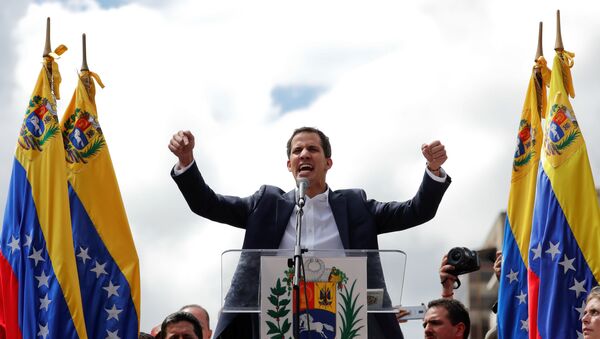 Juan Guaido, President of Venezuela's National Assembly, reacts during a rally against Venezuelan President Nicolas Maduro's government and to commemorate the 61st anniversary of the end of the dictatorship of Marcos Perez Jimenez in Caracas, Venezuela January 23, 2019 - Sputnik International