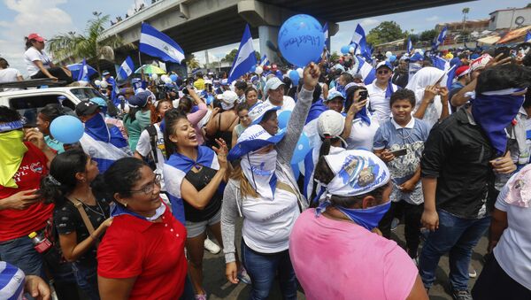 Protestors wave balloons and Nicaraguan flags during an anti-government event coined The March of Balloons in Managua, Nicaragua, Sunday, Sept. 9, 2018. The march aimed to raise awareness of what protesters call political prisoners and demand their release. - Sputnik International