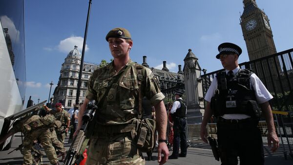 British Army soldiers board a bus outside the Palace of Westminster, comprising the Houses of Parliament and the House of Lords, in central London, on May 25, 2017 - Sputnik International