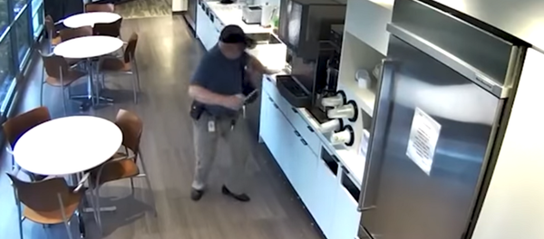 Alexander Goldinsky, 57, in security footage of his alleged fall in a New Jersey cafeteria, which prosecutors allege was faked Alexander Goldinsky, 57, in security footage of his alleged fall in a New Jersey cafeteria, which prosecutors allege was faked - Sputnik International