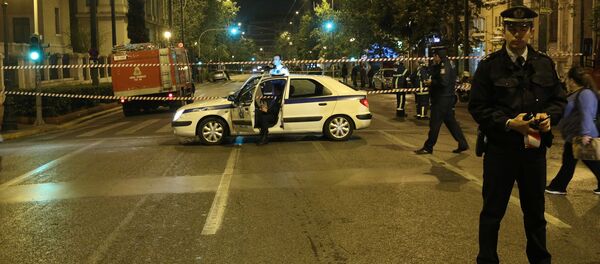 Greek police secure the area after a bomb blast in central Athens, Greece - Sputnik International