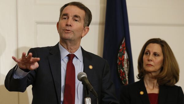Virginia Gov. Ralph Northam, left, gestures as his wife, Pam, listens during a news conference in the Governors Mansion at the Capitol in Richmond, Va., Saturday, Feb. 2, 2019 - Sputnik International