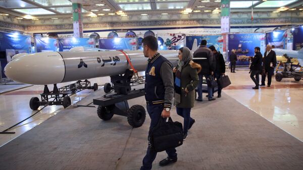 Visitors look at a Hoveizeh 8 cruise missile at a military show marking the 40th anniversary of Iran's Islamic Revolution. - Sputnik International