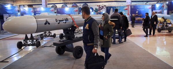 Visitors look at a Hoveizeh 8 cruise missile at a military show marking the 40th anniversary of Iran's Islamic Revolution. - Sputnik International