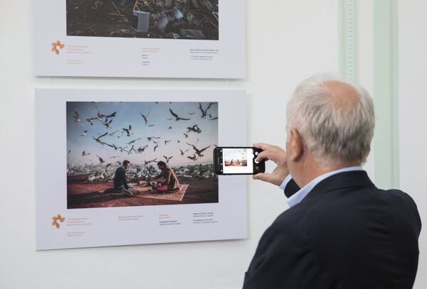 An exhibition by the Andrei Stenin International Press Photo Contest in Buenos Aires. - Sputnik International
