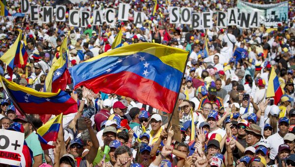 Supporters of Juan Guaido, self-proclaimed Interim President of Venezuela, take part in a rally, in Caracas, Venezuela - Sputnik International
