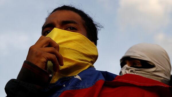 Demonstrators are seen during a protest against Venezuelan President Nicolas Maduro's government in Caracas, Venezuela February 2, 2019 - Sputnik International