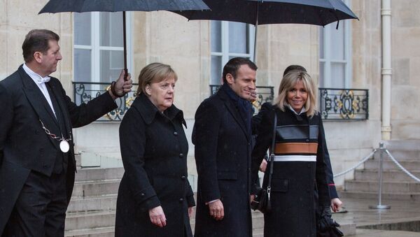Germany's Angela Merkel and France's Emmanuel Macron at France Armistice Day - Sputnik International