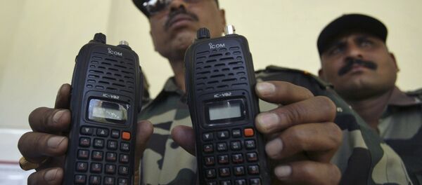 An Indian army officer displays satellite phones at Nagrota military station on the outskirts of Jammu, India, Monday, March 29, 2010 - Sputnik International