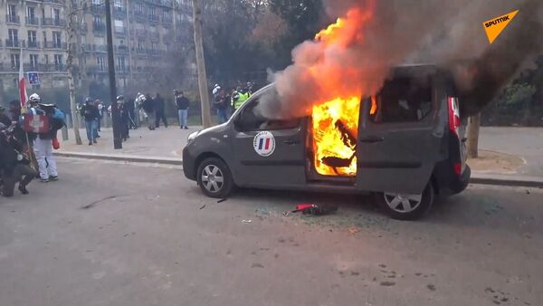 A car set afire amid Yellow Vests protests in Paris - Sputnik International