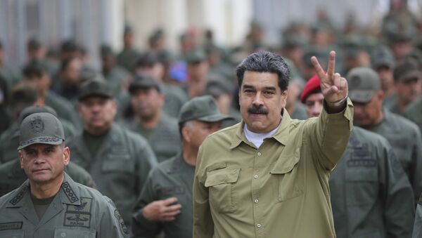 In this handout photo released by the Miraflores Presidential Press Office, Venezuela's President Nicolas Maduro flashes a V for Victory hand gesture after arriving at the Fort Tiuna military base in Caracas, Venezuela, Wednesday, Jan. 30, 2019.  - Sputnik International