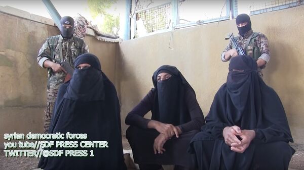 Kurdish forces capture terrorist militants trying to flee in hijabs. File photo. - Sputnik International
