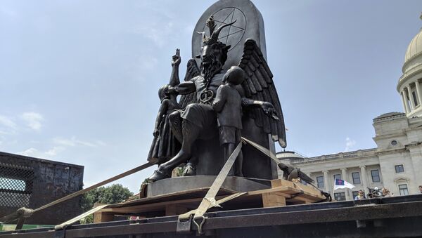 The Satanic Temple unveils its statue of Baphomet, a winged-goat creature, at a rally for the first amendment in Little Rock, Ark., Thursday, Aug. 16, 2018 - Sputnik International