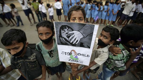 Indian children participate in a protest against child abuse and rising crimes against women, in Bhubaneswar, India, Saturday, March 16, 2013 - Sputnik International