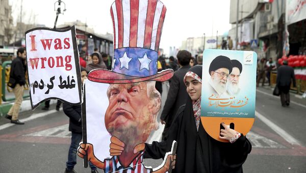 An Iranian woman holds an effigy of US president Donald Trump, during a rally marking the 40th anniversary of the 1979 Islamic Revolution, in Tehran, Iran, Monday, Feb. 11, 2019 - Sputnik International