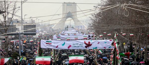 Iranian people gather during a ceremony to mark the 40th anniversary of the Islamic Revolution in Tehran, Iran February 11, 2019 - Sputnik International