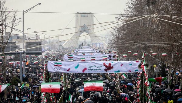 Iranian people gather during a ceremony to mark the 40th anniversary of the Islamic Revolution in Tehran, Iran February 11, 2019 - Sputnik International