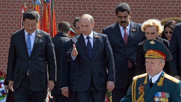 May 9, 2015. Russian President Vladimir Putin, 2nd left, at the flower-laying ceremony at the Tomb of the Unknown Soldier in Moscow's Alexander Garden. Left: President of the People's Republic of China Xi Jinping. 2nd right: President of Venezuela Nicolas Maduro - Sputnik International