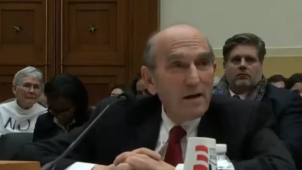 Elliot Abrams, the US special envoy to Venezuela, speaks with Minnesota Congresswoman Ilhan Oman during a House Foreign Affairs Committee hearing - Sputnik International