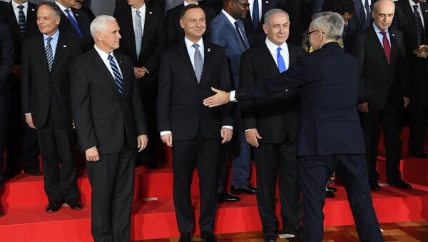 US Vice President Mike Pence, Poland's President Andrzej Duda and Prime minister of Israel Benjamin Netanyahu are seen during preparations for a family photo at the conference on Peace and Security in the Middle east in Warsaw, on February 13, 2019 - Sputnik International