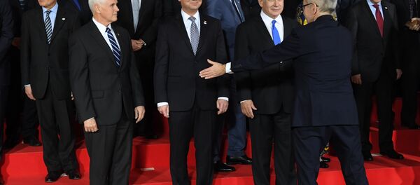 US Vice President Mike Pence, Poland's President Andrzej Duda and Prime minister of Israel Benjamin Netanyahu are seen during preparations for a family photo at the conference on Peace and Security in the Middle east in Warsaw, on February 13, 2019 US Vice President Mike Pence, Poland's President Andrzej Duda and Prime minister of Israel Benjamin Netanyahu are seen during preparations for a family photo at the conference on Peace and Security in the Middle east in Warsaw, on February 13, 2019 - Sputnik International