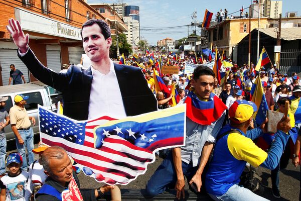 Opposition supporters carrying a cardboard cut-out of Venezuelan opposition leader Juan Guaido take part in a rally against Venezuelan President Nicolas Maduro's government and to commemorate the Day of the Youth in Maracaibo, Venezuela February 12, 2019. Opposition supporters carrying a cardboard cut-out of Venezuelan opposition leader Juan Guaido take part in a rally against Venezuelan President Nicolas Maduro's government and to commemorate the Day of the Youth in Maracaibo, Venezuela February 12, 2019. - Sputnik International