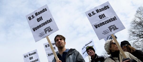 Activists rally against US intervention in Venezuela outside White House on January 26, 2019 in Washington, DC. Activists rally against US intervention in Venezuela outside White House on January 26, 2019 in Washington, DC. - Sputnik International