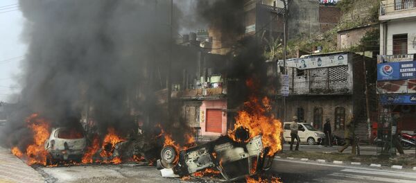 Vehicles stand in flames after it was set on fire by a mob during a protest against Thursday's attack on a paramilitary convoy, in Jammu, India, Friday, Feb.15, 2019 Vehicles stand in flames after it was set on fire by a mob during a protest against Thursday's attack on a paramilitary convoy, in Jammu, India, Friday, Feb.15, 2019 - Sputnik International