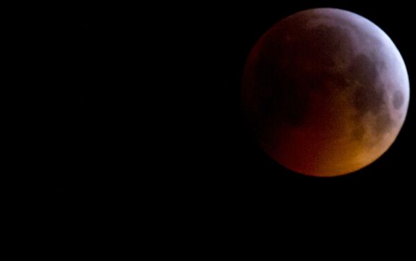 The Super Blood Wolf Moon eclipse in Antwerp, Belgium, Monday, Jan. 21, 2019. The eclipse takes place when the full moon is at or near the closest point in its orbit to Earth, a time popularly known as a supermoon. This means the Moon is deeper inside the umbra shadow and therefore may appear darker. The Super Blood Wolf Moon eclipse in Antwerp, Belgium, Monday, Jan. 21, 2019. The eclipse takes place when the full moon is at or near the closest point in its orbit to Earth, a time popularly known as a supermoon. This means the Moon is deeper inside the umbra shadow and therefore may appear darker. - Sputnik International