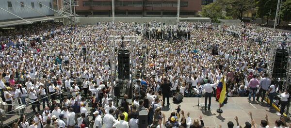 Nurses, doctors, professionals and others are sworn in by Venezuela’s self-proclaimed interim president Juan Guiado, as the group that will help with the arrival and distribution of humanitarian aid in Venezuela, during and event in Caracas, Venezuela, Saturday, Feb. 16, 2019. The U.S. Air Force has begun flying tons of aid to a Colombian town on the Venezuelan border as part of an effort meant to undermine socialist President Nicolas Maduro. The first of three C-17 cargo planes has flown from Homestead Air Reserve Base in Florida and landed in the town of Cucuta. - Sputnik International
