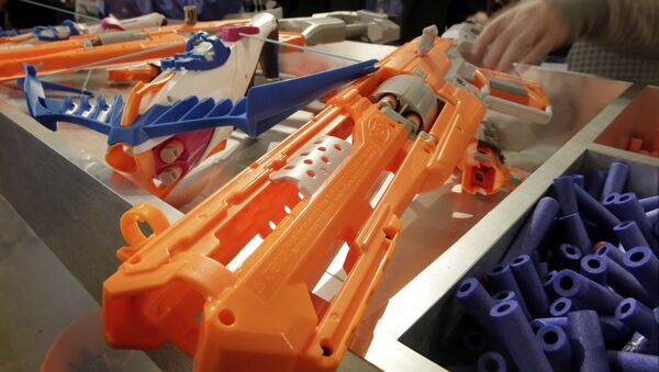 Nerf Accustrike Series Focus Fire Crossbow, left, and Alfa Hawk Blaster, right, from Hasbro, are shown at the ninth annual TTPM Holiday Showcase, in New York, Thursday, Oct. 6, 2016. - Sputnik International