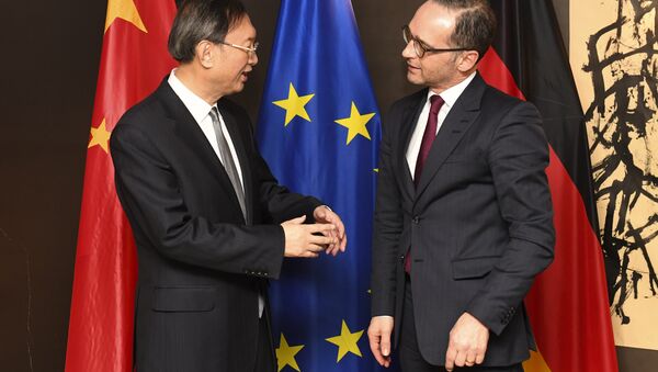Chinese Politburo Member Yang Jiechi , left, talks with German Foreign Minister Heiko Maas, right, during a bilateral meeting at the Munich Security Conference in Munich, Germany, Saturday, Feb. 16, 2019 - Sputnik International