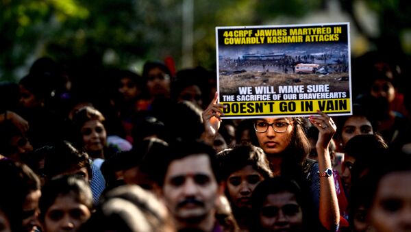An Indian student holds a poster during a procession to pay tribute to the Central Reserve Police Force (CRPF) troopers in Chennai on February 16, 2019, following an attack on a CRPF convoy in Kashmir - Sputnik International