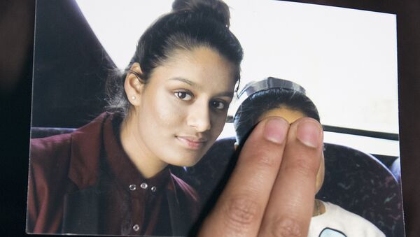 In this file photo taken on February 22, 2015 Renu Begum, eldest sister of missing British girl Shamima Begum, holds a picture of her sister while being interviewed by the media in central London - Sputnik International