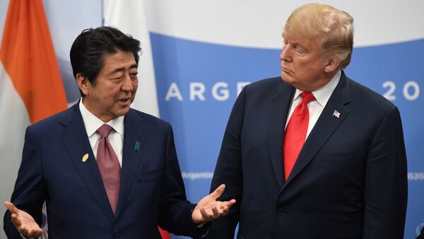 Japan's Prime Minister Shinzo Abe speaks with US President Donald Trump during a meeting in the sidelines of the G20 Leaders' Summit in Buenos Aires, on November 30, 2018 - Sputnik International