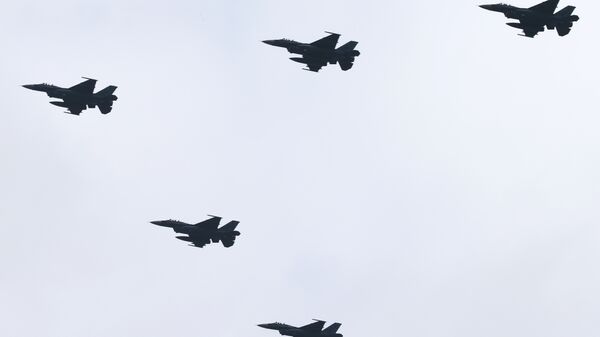 Japan's F-2 fighter jets fly in formation during the annual Self-Defense Forces Commencement of Air Review at Hyakuri Air Base, north of Tokyo, Sunday, Oct. 26, 2014. - Sputnik International